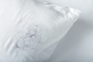 Soft pillow with fallen down hair