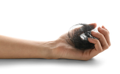 Obraz premium Female hand with fallen down hair on white background