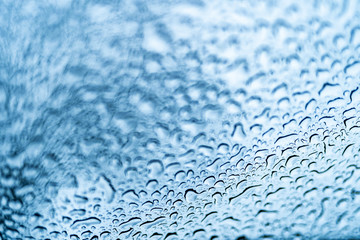 Beautiful view of clear raindrops on the window for background. Fresh drops on glass in the rainy weather. Close up