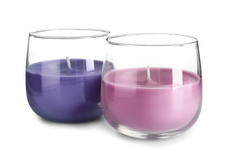 Different wax candles on white background