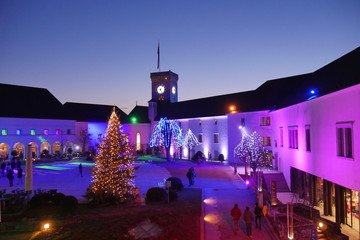 Colourful christmas lights and trees in Ljubljana Castle