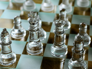  King and Queen chess pieces on wooden board