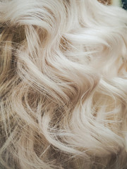 Curly blond hair. Close up.