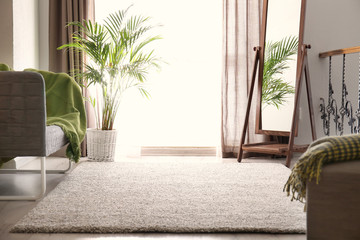 Naklejka premium Interior of modern room with comfortable sofa and big window