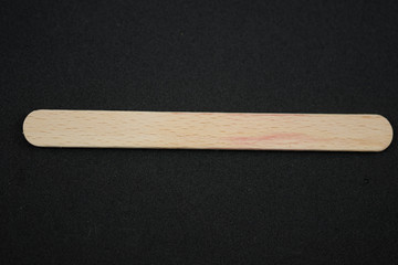 thin wooden support for ice cream