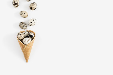 Uncooked quail eggs on white background top view, protein diet, healthy food concept. Flat lay, top view, copy space