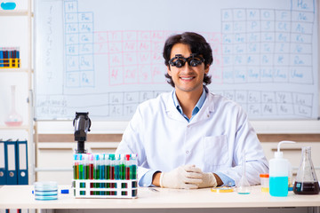 Young chemist working in the lab 
