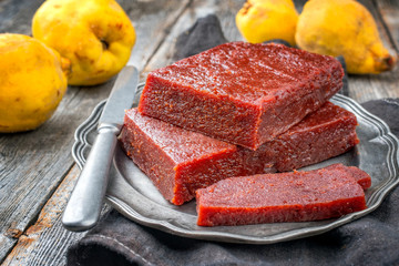 Traditional Spanish dulce de membrillo as fruit bread with quince as closeup on a pewter plate