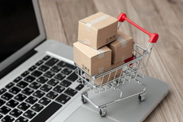 Delivery of the order from the online store. Online shopping. Boxes with goods in the shopping...