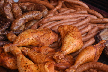 smoked meat, chicken legs, sausages