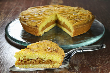 filled cake from the Dutch island of Texel called Razende Bol on wooden background