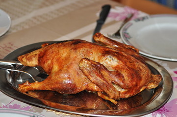 a chicken fried on a stainless steel tray