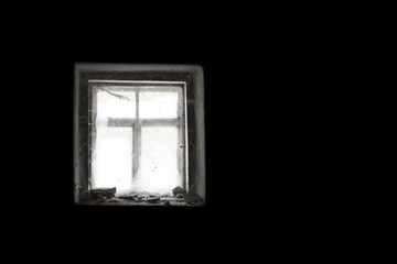 window in cobweb and dark