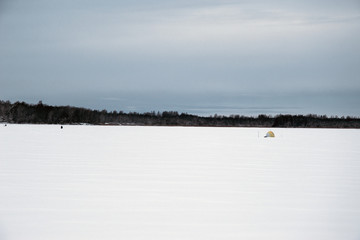 Snow-covered lake under the January sky