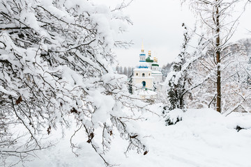 orthodox church in winter covered with snow