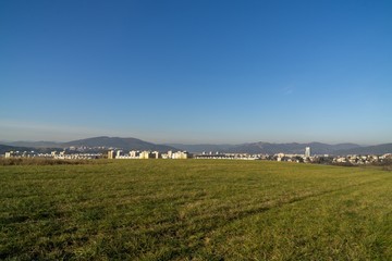 Fototapeta premium Green meadow during sunny and cloudy afternoon. Slovakia