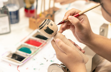Bangkok, Thailand - SEP 01, 2018 : people making Japanese Kokeshi dolls in the art workshop class,...