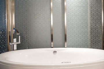 Luxury master bath with bath and glass wall