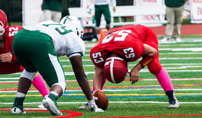Football long snapper ready to snap the ball