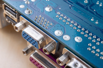 The motherboard and computer components. Computer accessories on a workshop table.