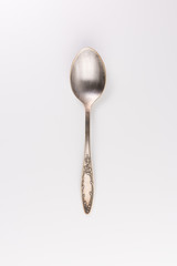Spoon with ornate handle on white background - Image