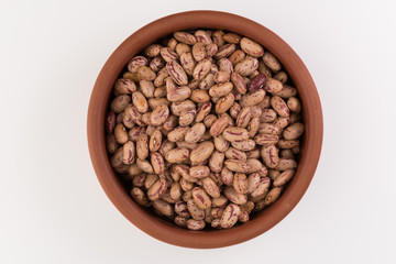 A plate of beans on white background
