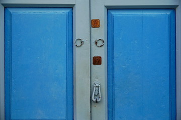 wooden door with lock and knocker