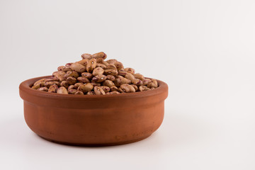 A plate of beans on white background