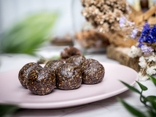 Healthy organic date energy balls with dark chocolate, dried fruits and nuts. Food for healthy lifestyle.