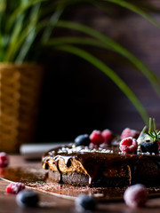 Chocolate cream tart cheesecake with fresh berries. delicious dessert for Birthday.