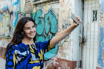 Fototapeta premium Latin woman making selfie.