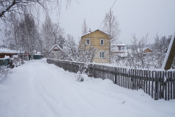 Winter village. House covered in snow