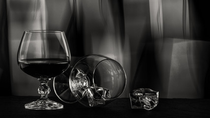 black white photo A glass of brandy Close-up