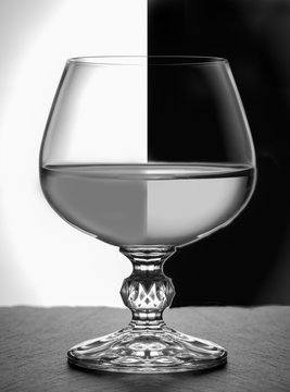 black white photo A glass of brandy Close-up