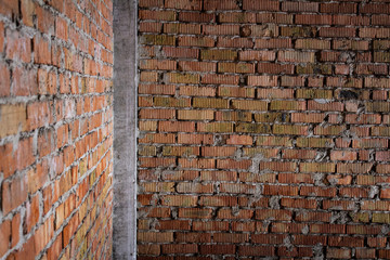 .Brick corner of an old abandoned unfinished building