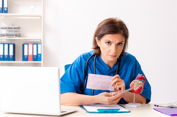 Female doctor cardiologist working in the hospital 