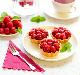 Homemade mini tarts with raspberries fruits
