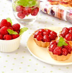Homemade mini tarts with raspberries fruits