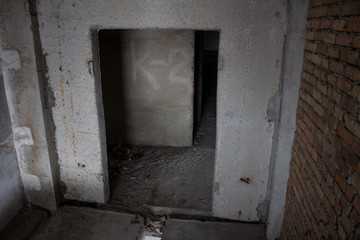 Neglected ruins of unfinished corps of building of plant