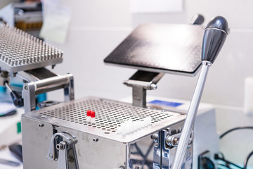 Medicine pills encapsulator in pharmacy laboratory