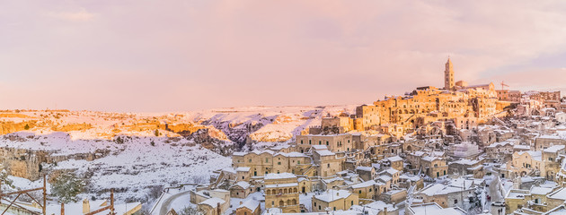 panoramic view of typical stones Sassi di Matera and church of Matera 2019 under blue sky with...