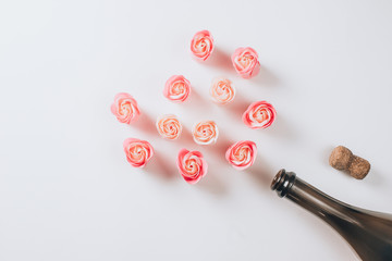 Champagne bottle with pink roses for Valentines Day.