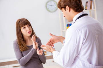 Deaf-mute female patient visiting young male doctor 