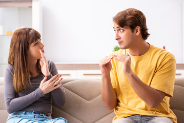 Woman and man learning sign language