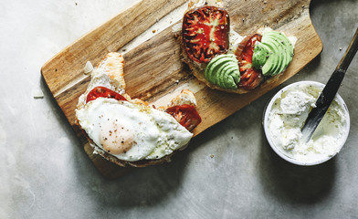 Croissant with heirloom tomato, avocado, and a fried egg