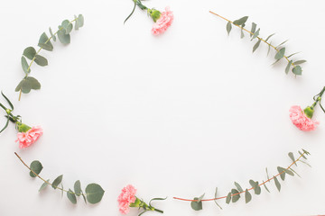 Flowers and eucaaliptus composition. Pattern made of various colorful flowers on white background. Flat lay stiil life.
