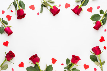 Flowers composition. Frame made of red rose on white background. Flat lay, top view, copy space.