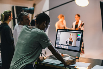 Art director checking the photos on a monitor