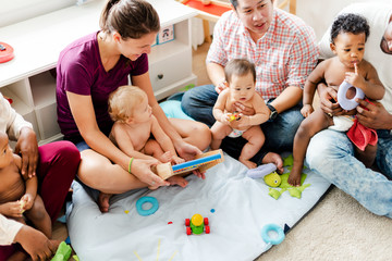 Cute babies with their parents