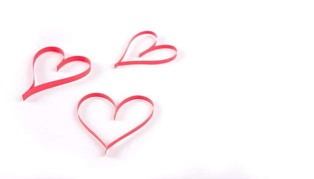 three red heart shape on white background